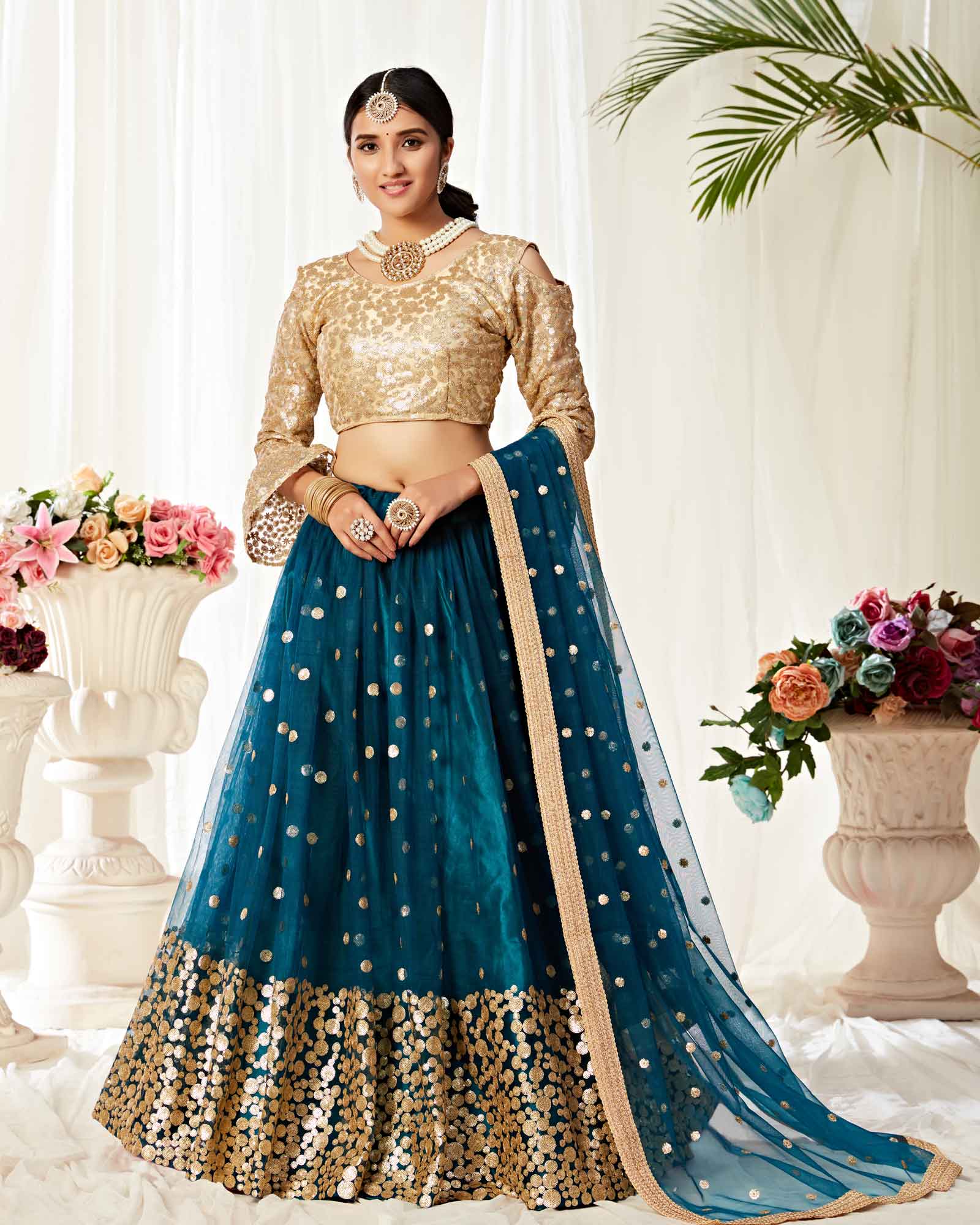 Peacock Green Heavy Net Lehenga Choli Paired With Net Dupatta